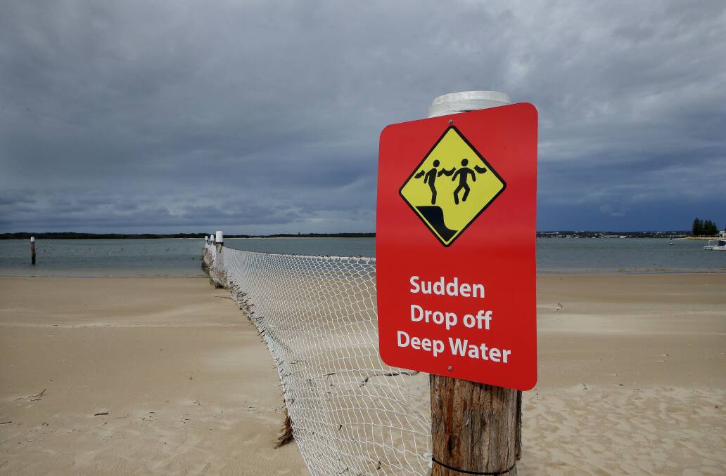 Beach danger: New "sudden drop off" sign at Dolls Point. Picture: John Veage
