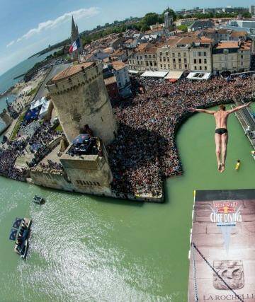 Artem Silchenko of Russia diving from the 27.5 metre platform on the Saint Nicolas Tower during the second stop of the Red Bull Cliff Diving World Series at La Rochelle, France. Gary Hunt of the UK won the event, with fellow Briton Blake Aldridge placing second and Orlando Duque of Colombia third. Photo: vincent curutchet