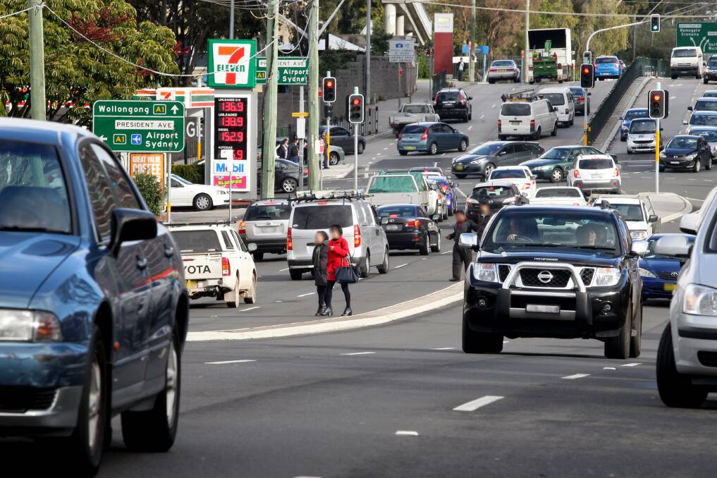 Dangerous business: Pedestrians take their chances crossing the highway near the Montgomery Street intersection despite traffic lights being close by. Pictures: Jane Dyson

