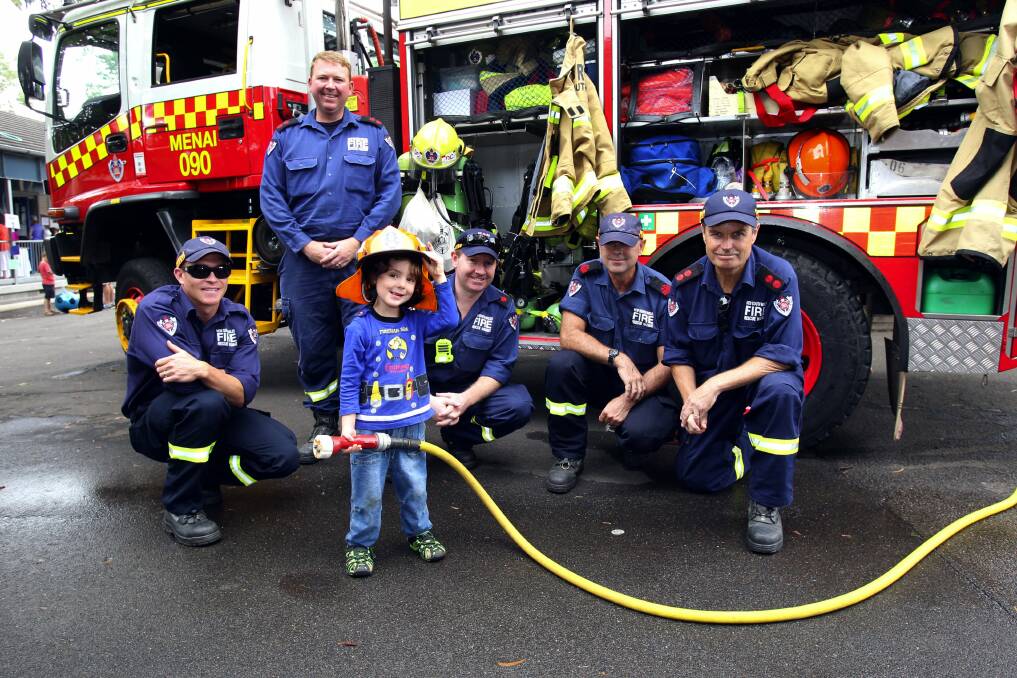 Serious art and lots of fun: Firefighters Kirran Duncan, Captain Brady Clarke, Deputy Captain Ben Miller, Barry Sutherland and Captain Wayne Challinor with little want-a-be firefighter Noah 3 from Oatley Picture : Lisa McMahon.
