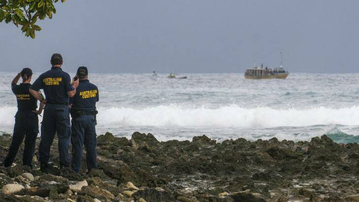 Customs officials watch a boatoad of asylum seekers approach the Cocos Islands in 2012. Photo: Karen Willshaw