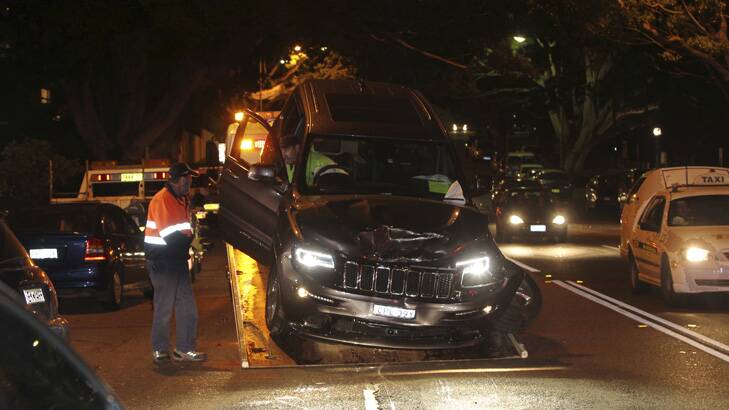 The crashed Jeep is removed from the scene after the crash. Photo: Britta Campion
