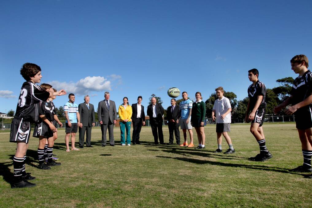 Field of dreams: Sharks players and Cronulla High School students at the school's playing fields which have been upgraded by developers Bluestone. Construction is due to start on the new clubhouse on the school grounds. Picture: Jane Dyson