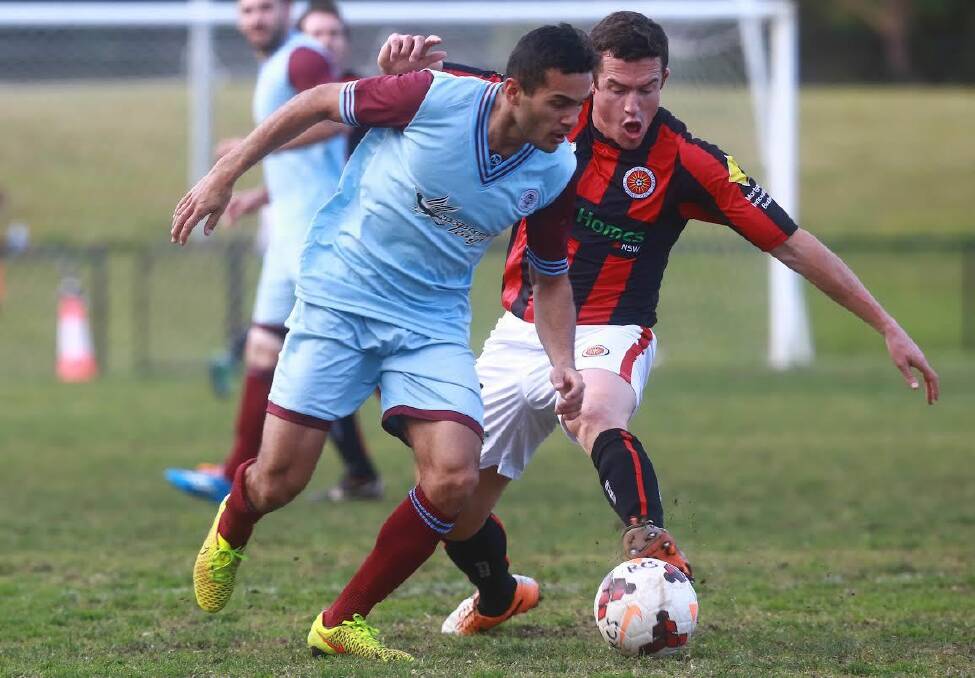 Tussle: Action from players in the Rockdale City Suns (right) and Apia Leichhardt Tigers game at Ilinden Sports Centre on Sunday. Picture: Football NSW