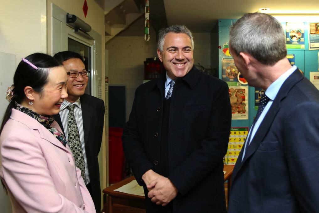 Penshurst visit: L to r: Deputy mayor of Hurstville Nancy Liu, Michael Yin, representing the southern region of the NSW Chinese Business Association, Treasurer Joe Hockey and Banks MP David Coleman at 3Bridges Community Centre, where a government grant was announced and a business forum held. Picture: John Veage