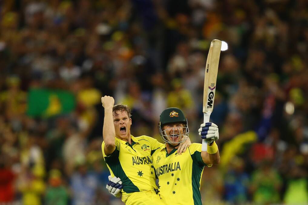 We did it: Sutherland duo Steve Smith and Shane Watson celebrate after the pair steered the team home to the ICC World Cup final win over New Zealand on Sunday at the Melbourne Cricket Ground. Picture:  Ryan Pierse, Getty Images
