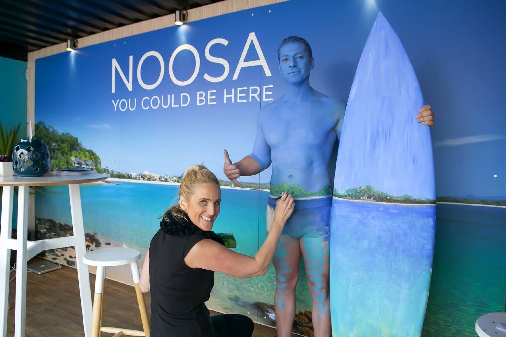 Paints alive: Julie Tattam splashes out on a male model for a Sunshine Coast advertisement. Picture: Paul Smith Images
