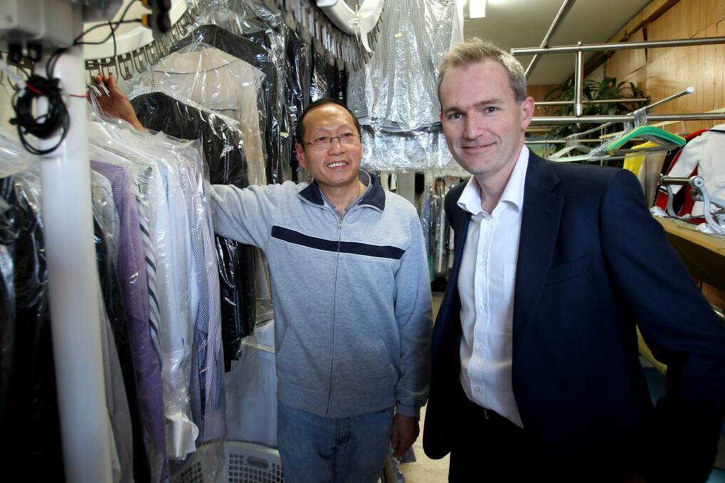 Back to normal:  Clean Brite Dry Cleaners owner Chen Zeng with David Coleman. Picture: Jane Dyson