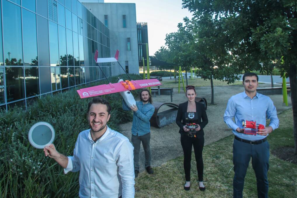 Think big: Daniel Cvetkovski, Nathan Tarlinton, Sally Reynolds and Fahad Alizai at the Innovation campus in Fairy Meadow with their competition entries in the Innovation Works! competition. Picture: Adam McLean