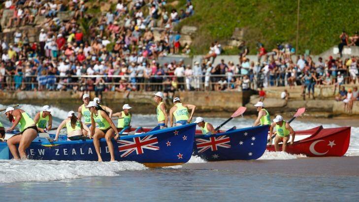 Surf boats  in New Zealand, Australia and Turkish colours  arrive to Collaroy beach. Photo: Daniel Munoz