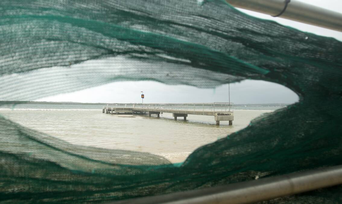 Concern: A view through the mesh at the beach at Dolls Point. Picture: Chris Lane