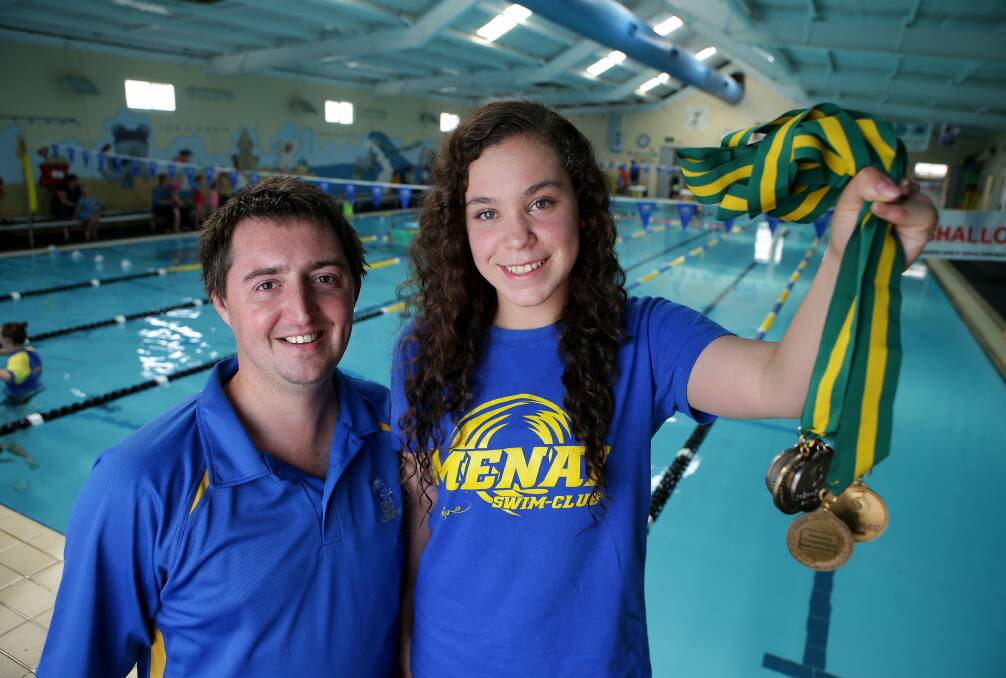Pool triumph: Swim coach Simon Watkins with top athlete Nicole Miro. Picture: John Veage