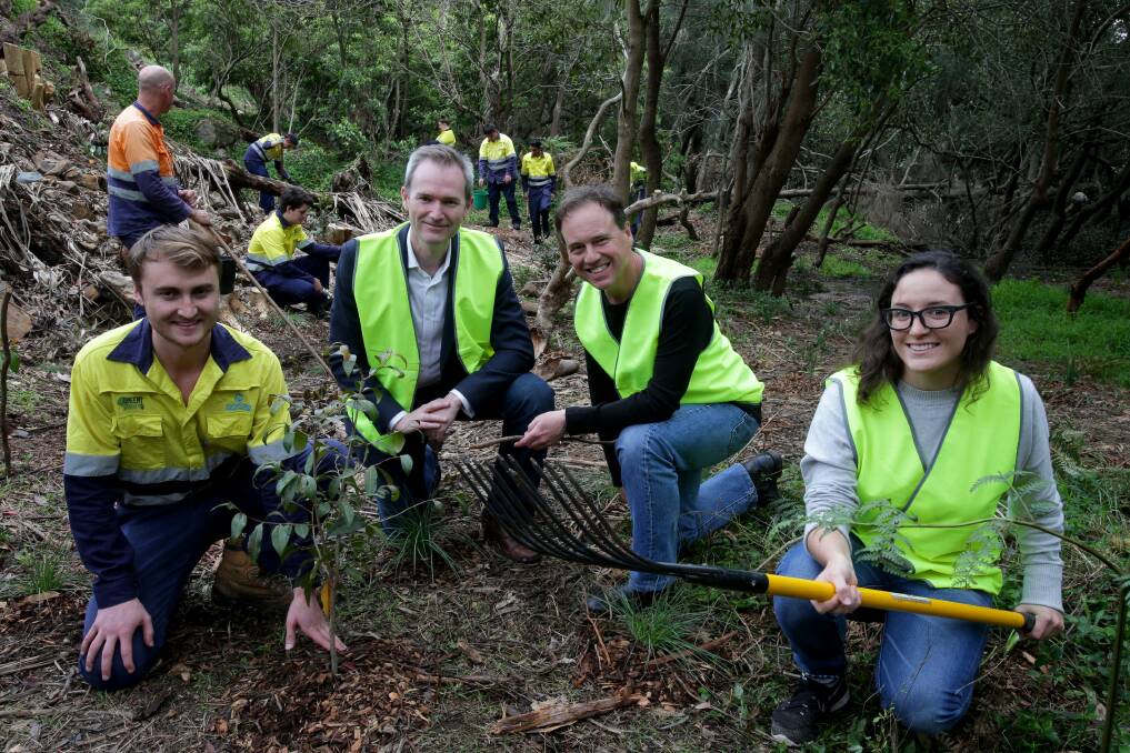 Environment work: Environment Minister Greg Hunt joins the green Army, from left: Cody Brady, David Coleman, Greg Hunt and Lisa Smoleniec. Picture: Jane Dyson