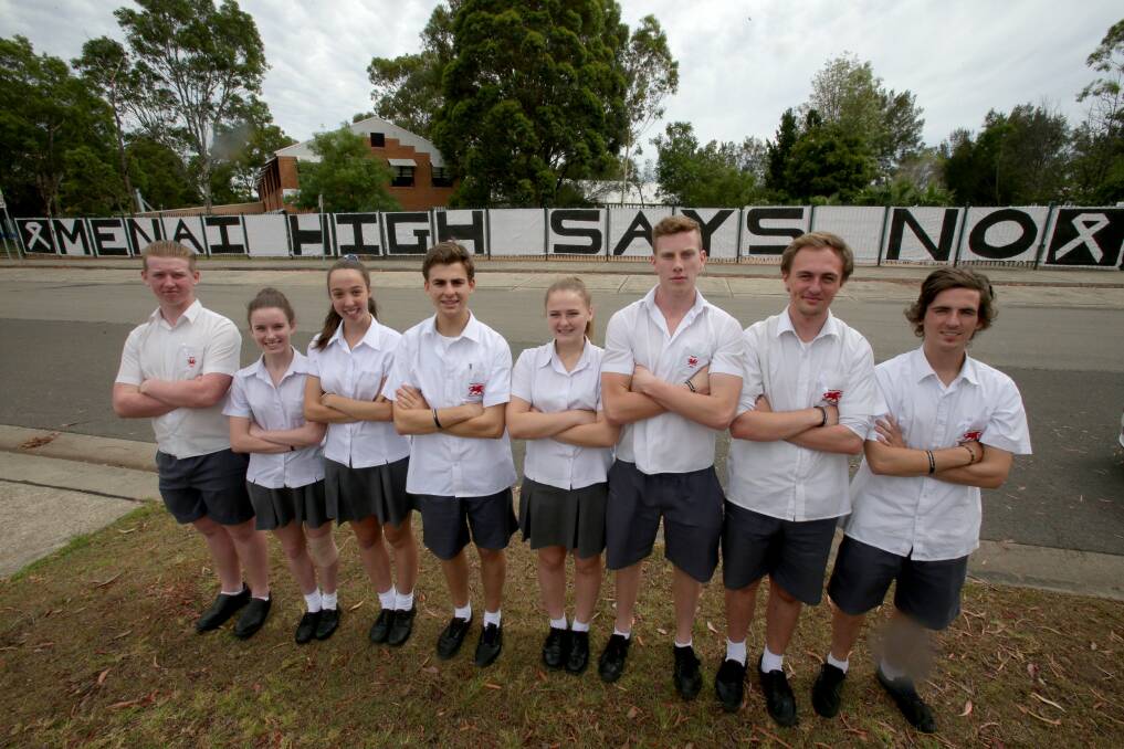 Respect: Menai High School students marked white ribbon day (violence against women) by wrapping the front of the school in a large banner that says "Menai high says no", encouraging the community to sign it.