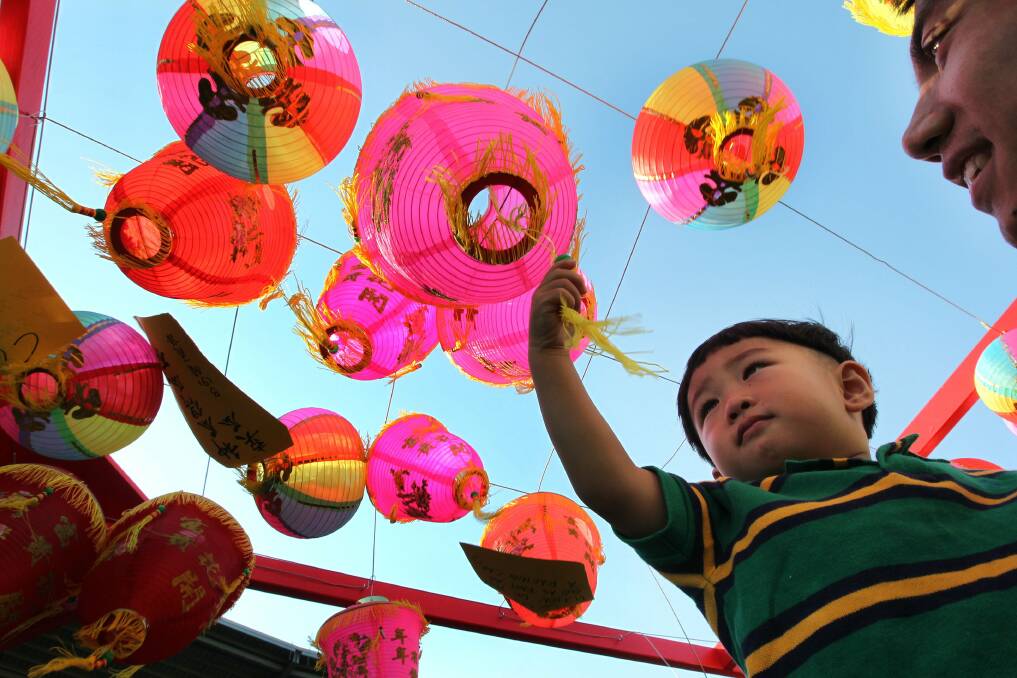 The horse is leaving, the goat is coming: Jason, 3, enjoying Chinese New Year celebrations last year at Kogarah. Picture: John Veage