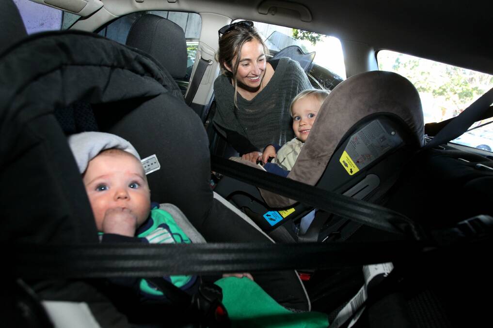 Admirable restraints: Rebekah Lorimer with her children Malakai, 2 and Kale, 4 months in properly fitted car seats. Picture: Jane Dyson