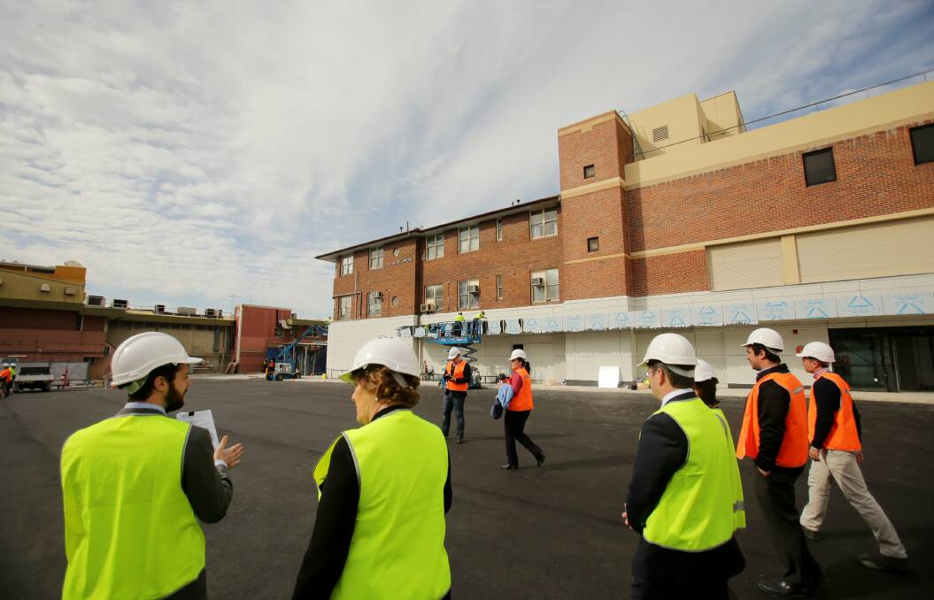 Evolution: Hospital buildings from different eras provide a backdrop as Jillian Skinner and Mark Coure inspect the new car park. Picture: Chris Lane