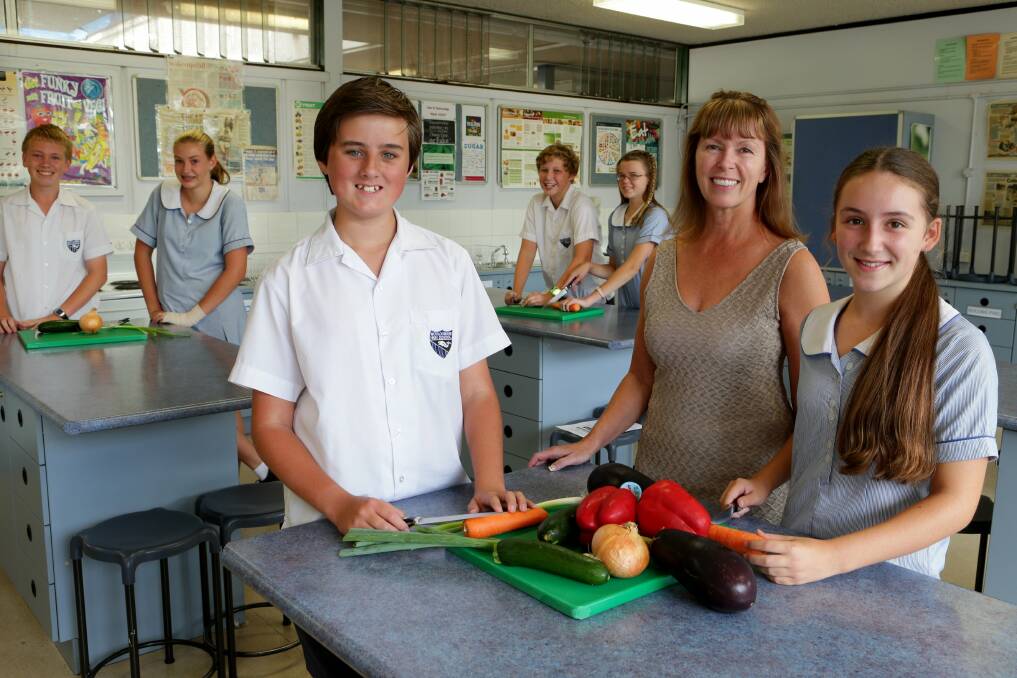 Real food: Home economics head teacher Ingrid Moon with students Joshua Cowie, Rachel Sercombe, Jack Vanderlaan (front left), Jake Watson, Kristen Chirgwin and Georgia Holmes (front right), is teaching students the importance of home cooking. Picture: Jane Dyson