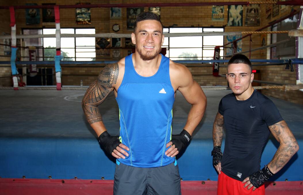 Boxing brothers: Sonny Bill Williams and George Kambosos jnr on Friday night at Rockdale PCYC. Picture: Chris Lane