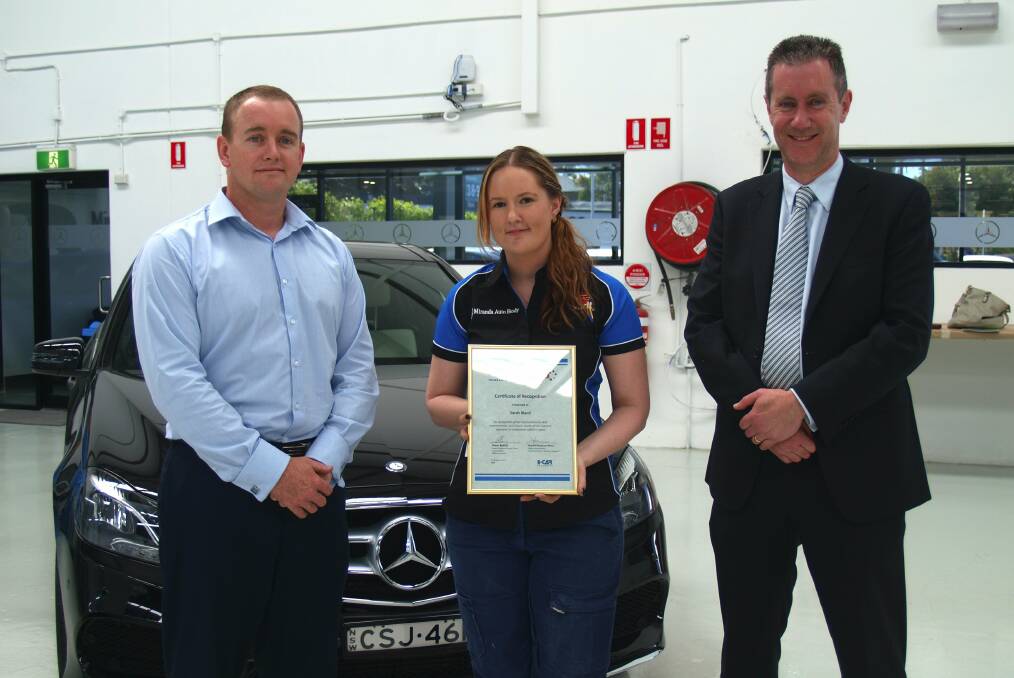 Industry head start: Sarah Bland (centre) won an award for her studies in the auto body repair industry. She is pictured with Paul McKay, of Miranda Body Shop, and Lachlan Wymer, of Mercedes-Benz.