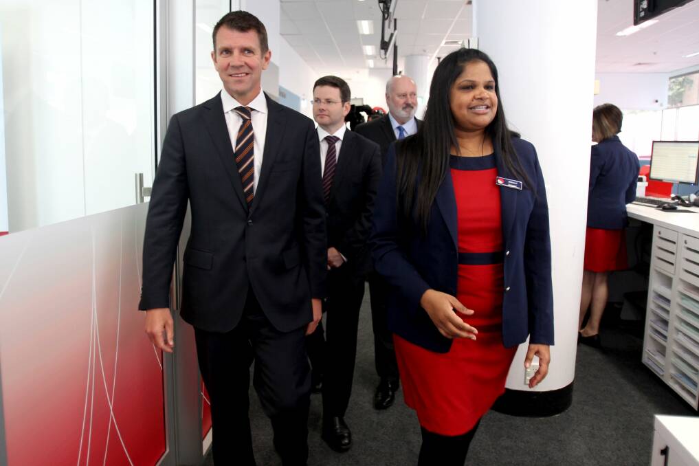 One stop shop: Premier Mike Baird, and MPs Mark Coure and John Flowers at the opening of the Hurstville office of Service NSW with manager Shivani Vythianathan. Picture: Jane Dyson
