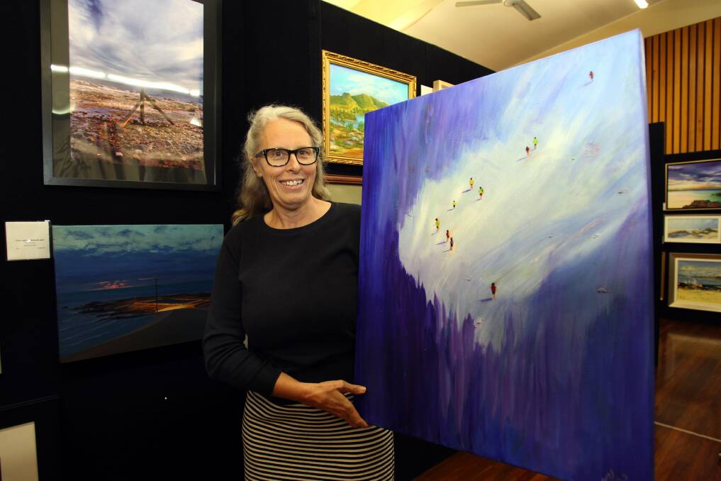 Serious art and lots of fun: One of the exhibitors Nola MacFarland with one of her paintings " Right out of the blue". Picture : Lisa McMahon.