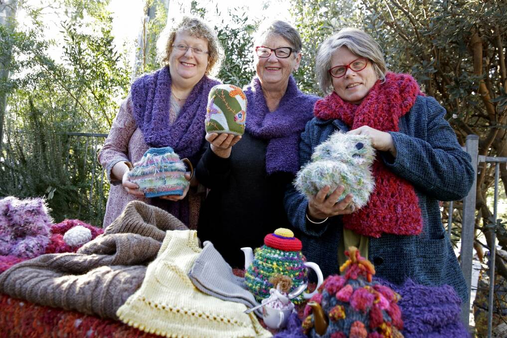 Winter woolies: Fi Shewring (left), Lynn Christie and Tracey Curtain prepare for the festival. Picture: Anna Warr