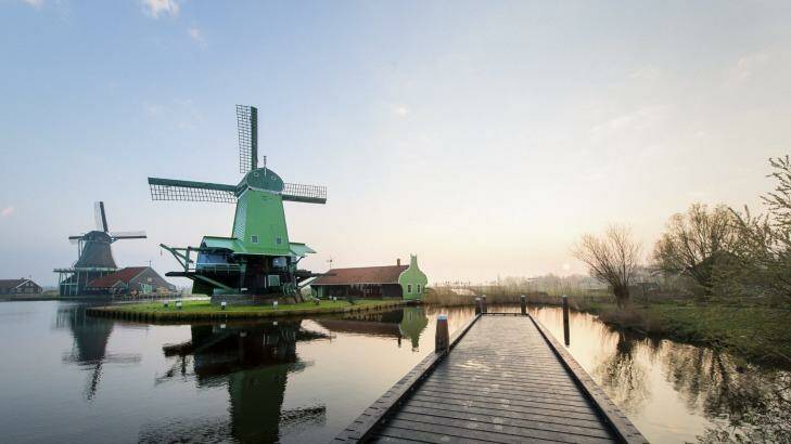 Typical scene: Traditional Dutch windmills at the Zaanse Schans in The Netherlands, seen from a yetty. Photo:  iStock
