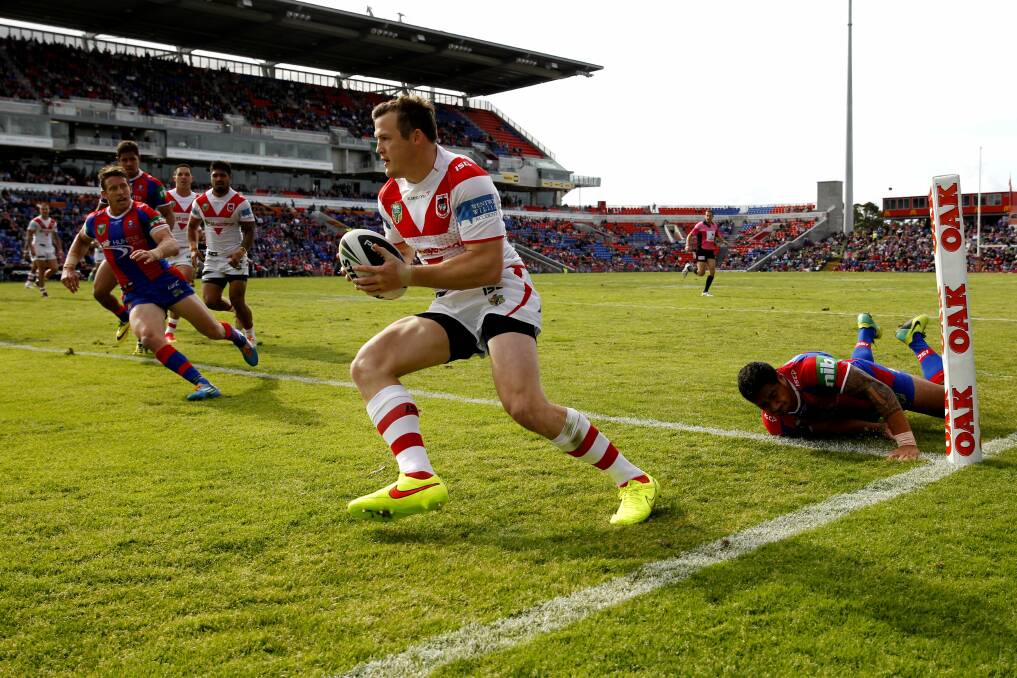 Speculation: Dragons winger Brett Morris scores a try in the 40-10 loss to Newcastle at Hunter Sports Stadium. The Bulldogs are chasing the prolific try scorer. Picture: Johathan Carroll