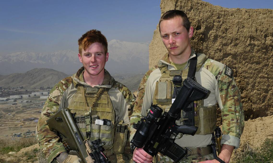 Long way from home: Privates Todd Haig (left) and Dominic Simpson on a hill overlooking Camp Qargha, Afghanistan. They are deployed to the Force Protection platoon at the Afghan National Army Officer Academy at Camp Qargha, Afghanistan.