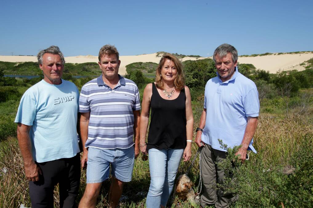 Sandhills saviours: John Sullivan, Scott Hogan, Annette Hogan and Warwick Kent helped save the sand dunes 20 years ago. Picture: Jane Dyson