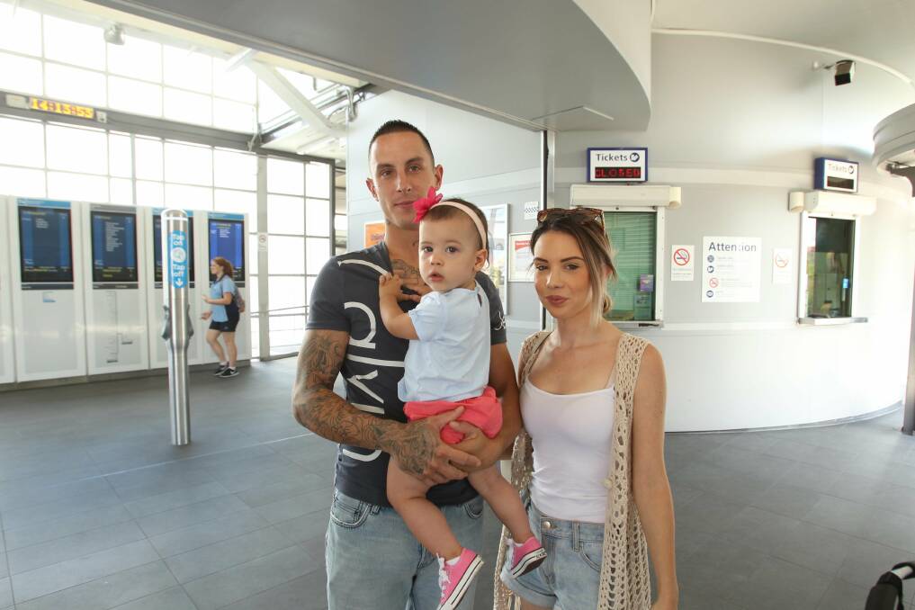 Customer "dis-service": Phillip and Alana Patricelli with Ava, 16, months, at Sutherland railway station where the ticket office opening hours are to be greatly reduced.  Picture: Chris Lane