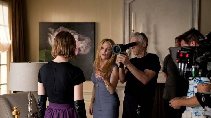 On the set: Cronenberg at work on <i>Maps to the Stars</i> with Mia Wasikowska (left) and Julianne Moore.