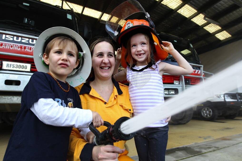 Family fun: Rural fire stations, including Sutherland, will open their doors on Saturday. Tyson and Mykaelah are pictured with Danielle Meggos. Picture: John Veage