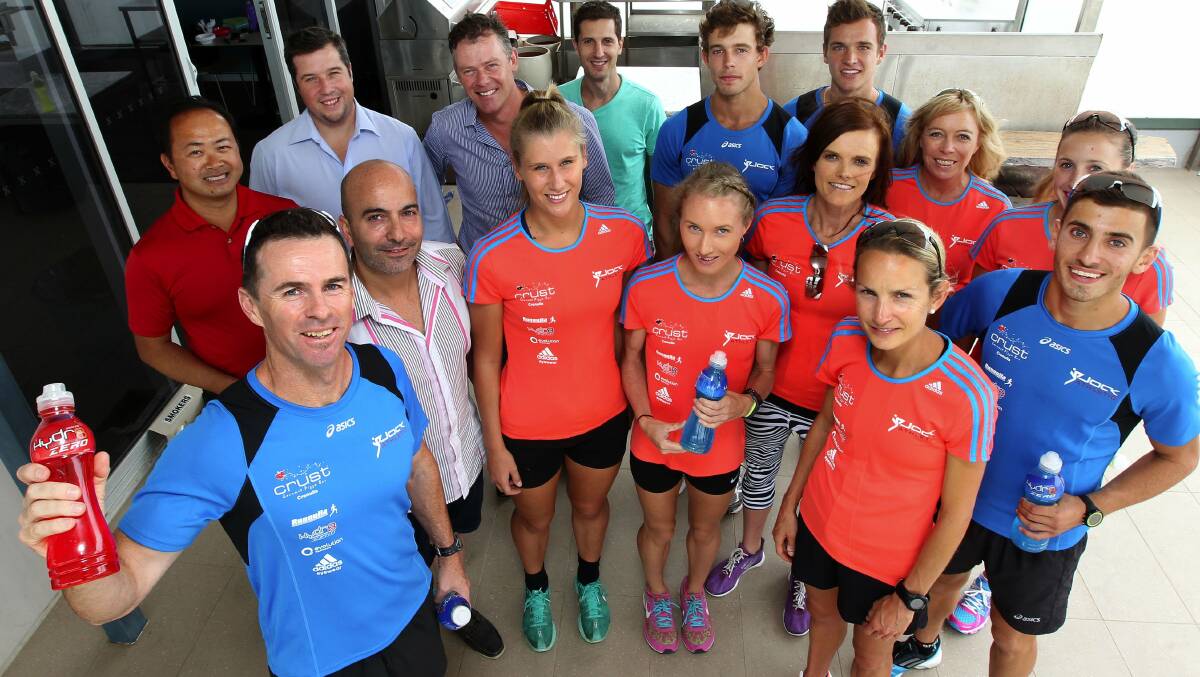 Flying high: Athletics coach Jock Campbell (front) with his athletes and staff before heading off to their high altitude camp in the Snowy Mountains. Pictures: John Veage
