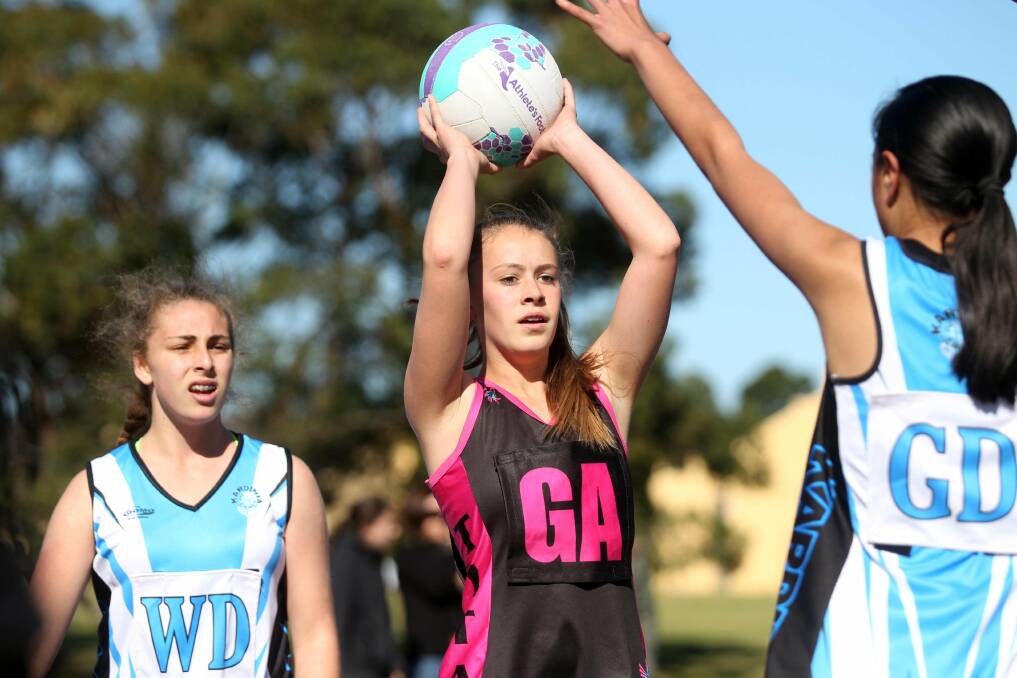 St George netball is thriving: Action between fifth division the 13-14As Titans Red and Kardinia Kingfishers game on Saturday at West Botany Street, Rockdale. Picture: Chris Lane