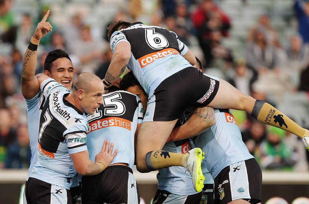 Celebration: Cronulla players celebrate Saturday's thrilling golden point win over Canberra. Picture: Stefan Postles, Getty Images