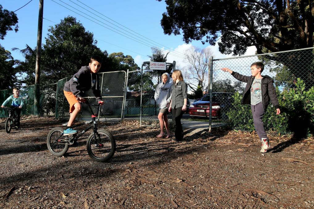 Community relief: The gates are open and all is well. Tayla, Benjamin, Mallee, Keegan and Trey use the open gate. Picture: Jane Dyson
