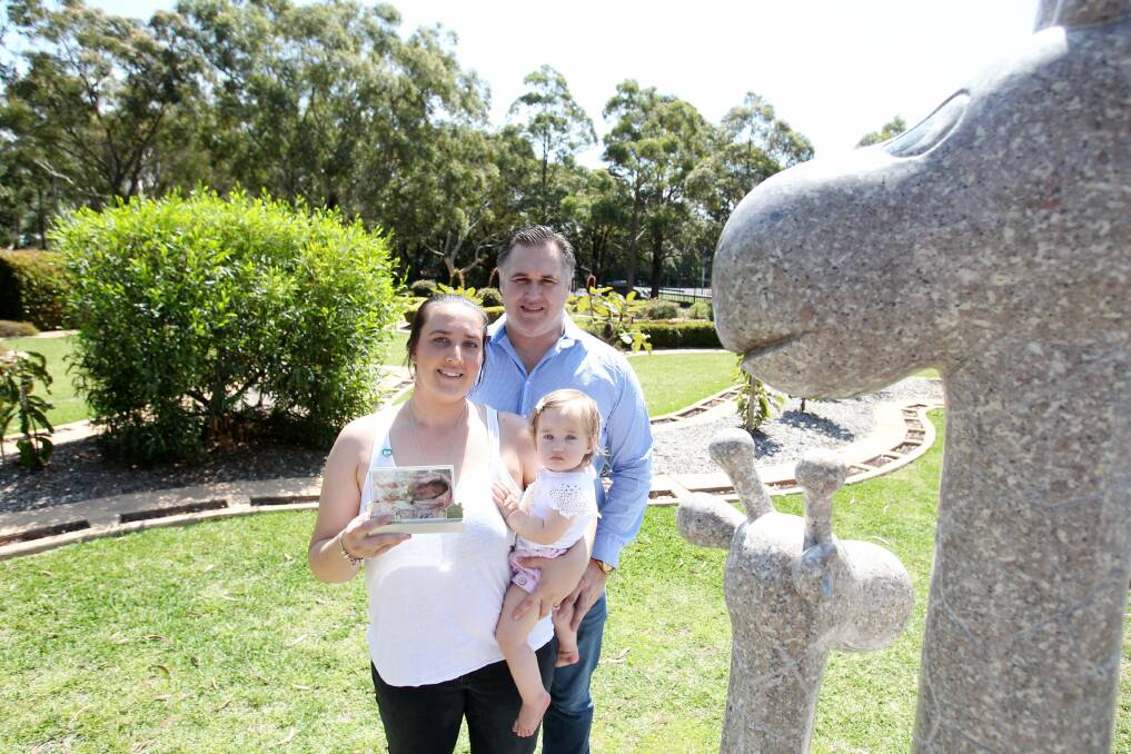 Pause to remember: Alison McDonald and David Bale, of Woronora (pictured with their daughter Savannah) will attend the Pregnancy and Infant Loss Remembrance Day service at Woronora Memorial Park. Picture: Chris Lane