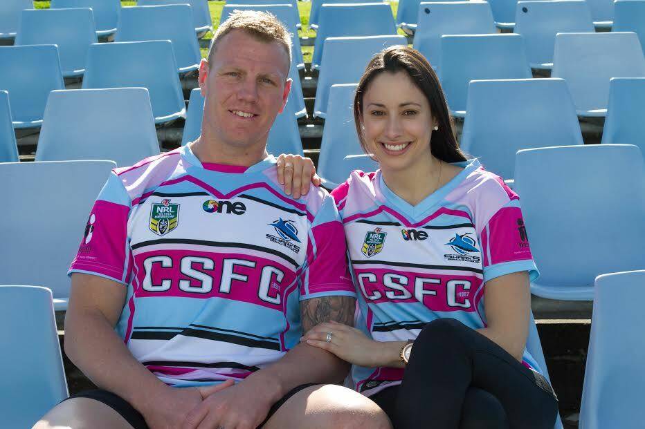 Togetherness: Luke and Sonia Lewis with the jerseys that Sharks players will wear to promote the Women in League round on Saturday.