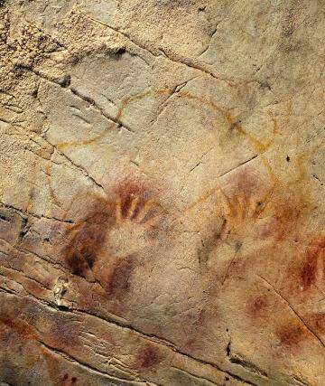 Book one: Panel of Hands, El Castillo Cave, Spain.  Photo: AP/Pedro Saura