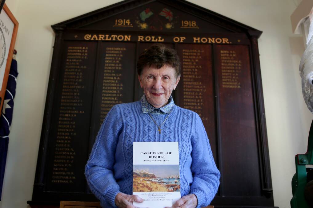 Not forgotten: Beverley Earnshaw with a new book on the 164 names on a WWI honour roll in the Carss Park Museum. Picture: Jane Dyson
