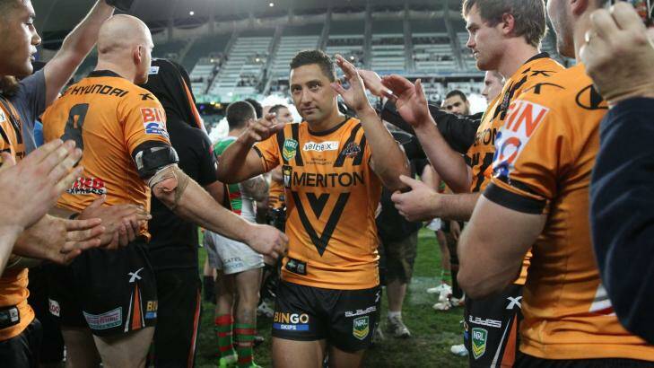 Milestone: Benji Marshall is given a guard of honour by his Wests Tigers teammates after his 200th game for the club last August. Photo: Brendan Esposito