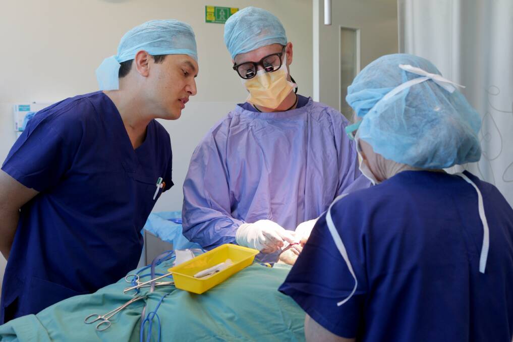 A new approach: Dermatologist Saleem Loghdey and Mohs [skin cancer surgeon] registrar Louis Wessels in surgery. Picture: Jane Dyson