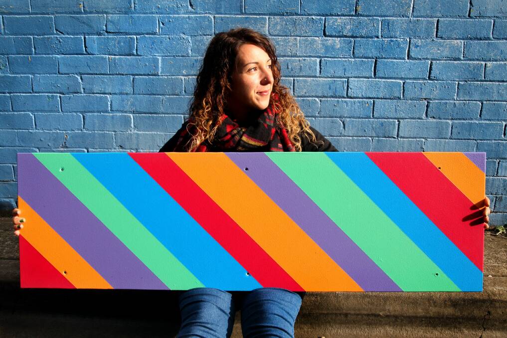 Colourful rejuvenation: Rockdale artist Sophia Egarchos contributes her artistic talents to the Living Laneways project. Picture: Jane Dyson