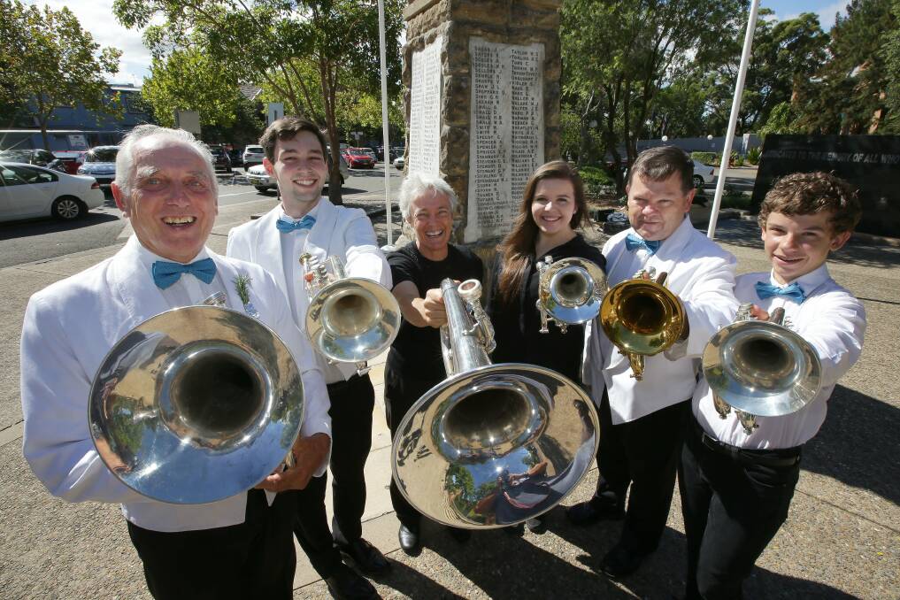 Bold as brass: Sutherland Shire Bass members prepare for their A Salute to Our Diggers concert — (from left) Keith Rose, Joel Nicolai, Jane Hall, Casey Williams, Stephen Williams and  Kieran Williams in front of the war memorial at Sutherland. Picture: John Veage

