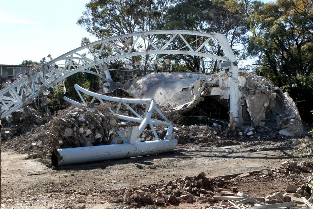 Out with the old: the old dome at Georges River College Peakhurst Campus being demolished. Picture: Jane Dyson