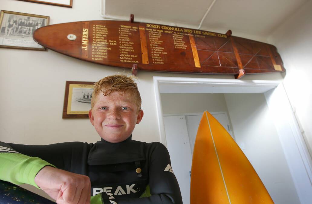 Surfing legacy: Finley Padman, 13, from Cronulla boardriders club is the same age as John Myers when he purchased his redwood Alia surfboard in 1937. Picture John Veage
