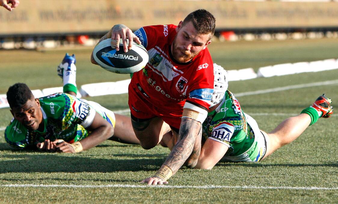 How sweet it is: Josh Dugan scores a try against his former club, the Canberra Raiders, at GIO Stadium on Saturday. Picture: Renee McKay, Getty Images