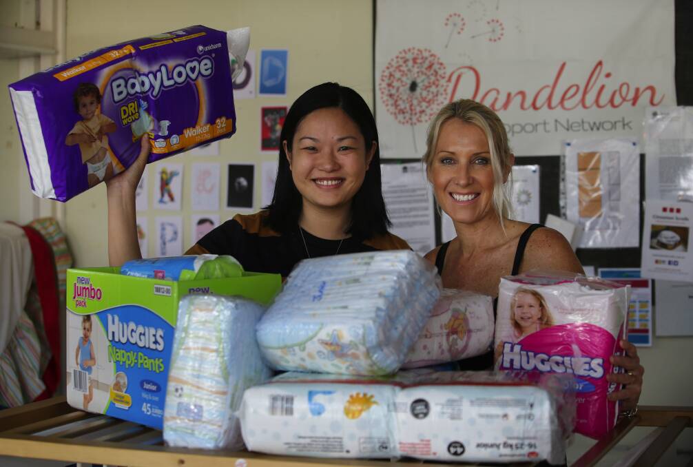Help at hand: The Nappy Collective's Joanne Hicks and Dandelion Support Network's Phoebe Judd with donated nappies. Picture: John Veage